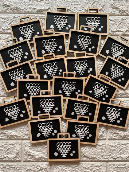 A flat-lay of the 'Saraswati Pati' magnets, showing the quantity prepared for a bulk order.