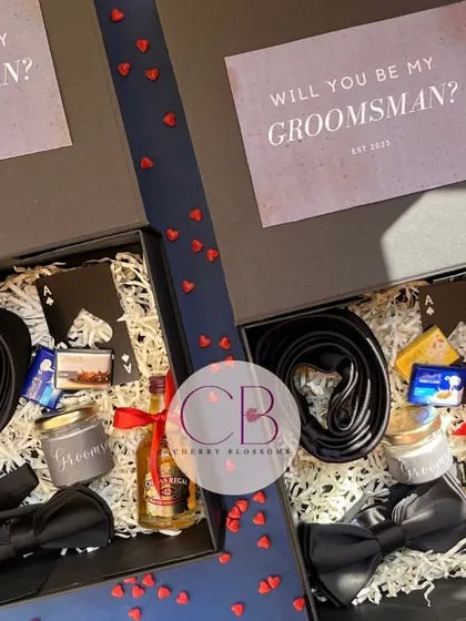 Why should girls have all the fun? We believe the groom's crew deserves to be celebrated too. We launched these "Will you be my Groomsman?" boxes, each packed with a tie, bow tie, a miniature drink, and other essentials to suit up for the big day.