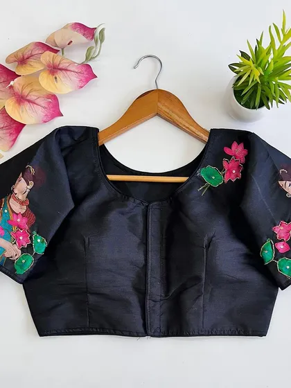 The front view of the black printed pure silk blouse, showing the artwork on the sleeves.