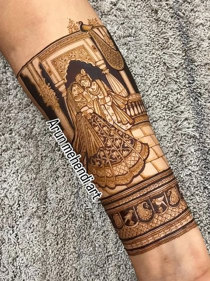 A beautiful depiction of Radha and Krishna, symbolizing divine love. This is a popular and auspicious choice for bridal mehendi.