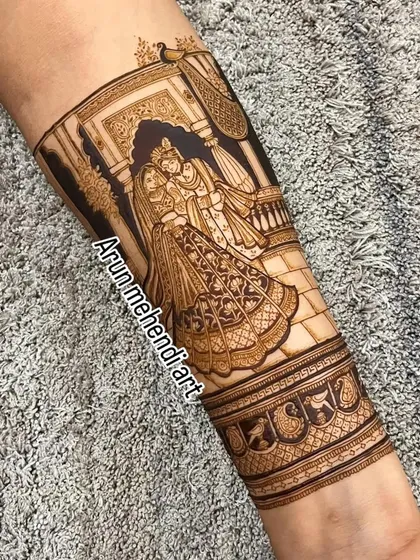 A beautiful depiction of Radha and Krishna, symbolizing divine love. This is a popular and auspicious choice for bridal mehendi.