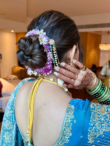 Another angle of the floral bun, showing how the flowers are carefully placed to create a beautiful, balanced look.