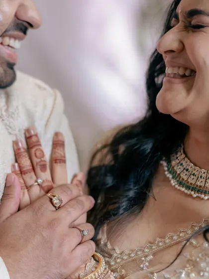 A repeat of the joyful close-up after the ring exchange, emphasizing the happiness and connection of the moment.