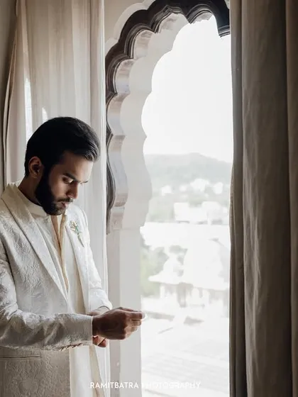 A quiet moment of anticipation as the groom gets ready. I believe the groom's story is just as important, and I focus on capturing these reflective, behind-the-scenes moments that build the narrative of the wedding day.
