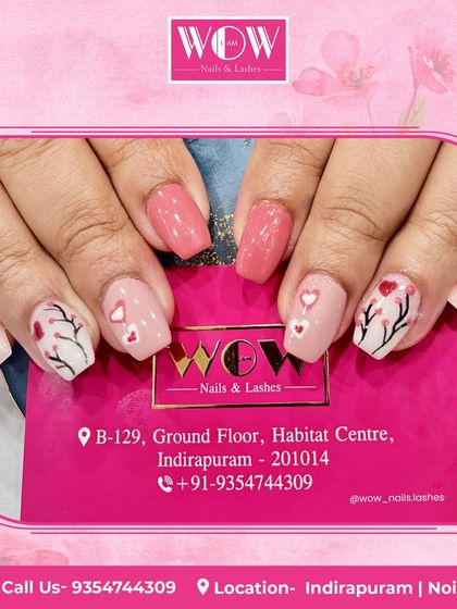 A sweet and romantic design featuring a pink base with hand-painted hearts and delicate tree branches. A perfect look for Valentine's Day or any day you're feeling the love.