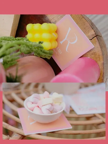 Another look at the personalized details, showing how even the smallest elements like coasters and candles were designed to match the event's theme.