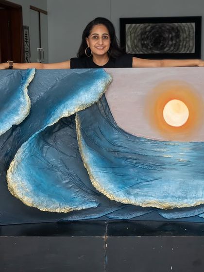 Standing proudly with the full "Golden Tides" artwork. This large-scale piece captures the immense power and beauty of the ocean.