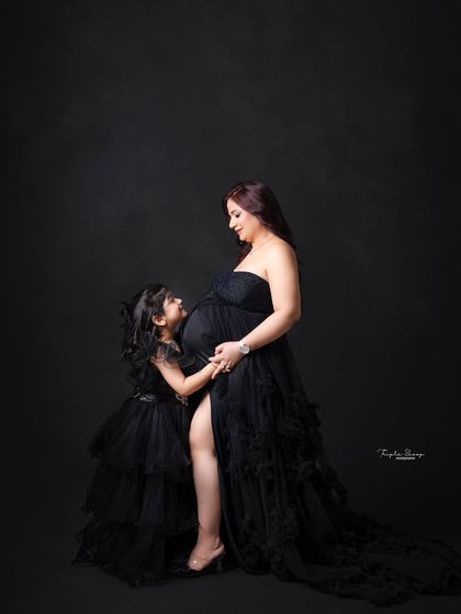 A beautiful profile shot of a mother and daughter, highlighting their connection and the anticipation of the new family member.