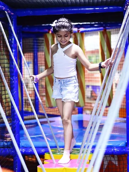 Taking on the challenge of the rope bridge in our My Maze play structure. This activity is great for building balance and confidence in older kids, all within a fully netted and padded environment for complete safety.