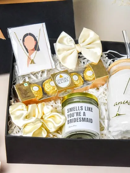 This beautifully arranged bridesmaid proposal hamper shows my skill in styling and capturing gift sets. The composition highlights each item, from the custom candle to the sipper, creating an aspirational image that drives sales.