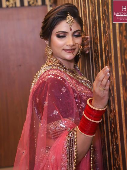 A side profile of the bride from the masterclass, focusing on the intricate details of the hair and makeup.