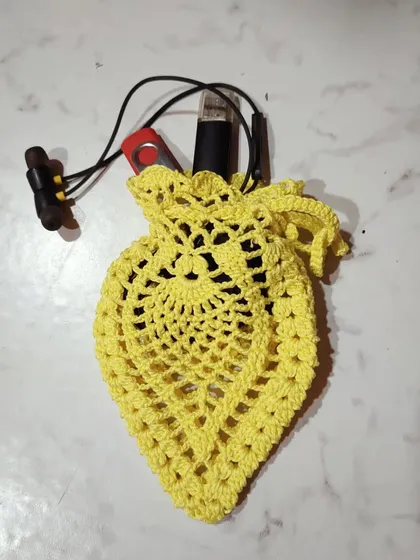 This yellow pouch is the perfect size for keeping headphones and a USB drive from getting tangled in a bag.