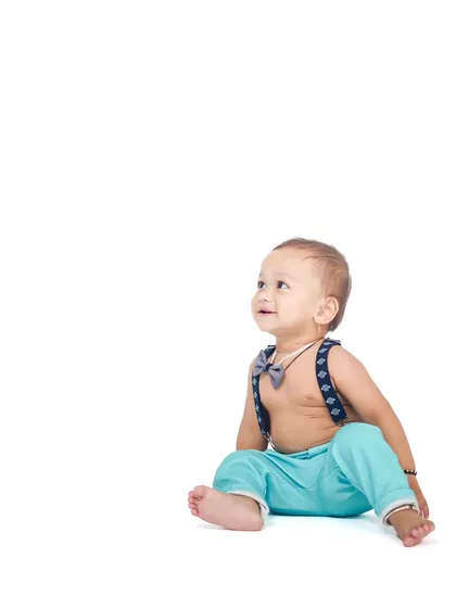 A simple and clean portrait on a white background, focusing entirely on the baby's curious and upward gaze.