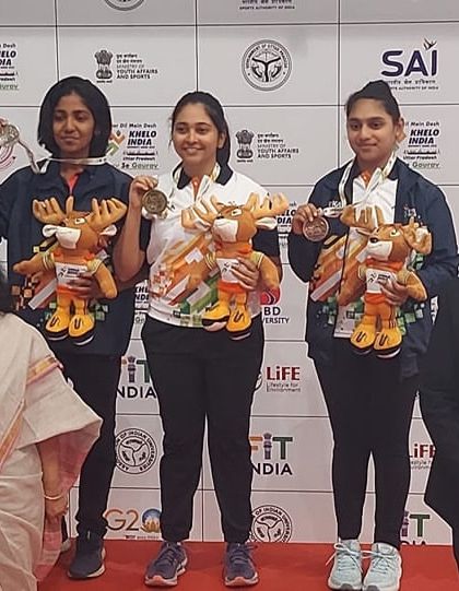 Our shooter Yukthi on the podium after winning a bronze medal at the Khelo India University Games 2022. Competing at this level is a significant achievement.