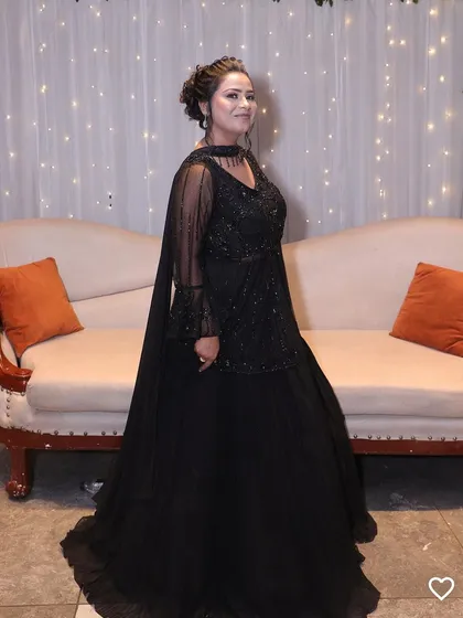 Classic, elegant, and always in style. Our client looks stunning in this all-black embellished outfit, proving that you can never go wrong with black for an evening party.