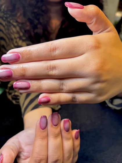 Another perspective of the pink aura nails, highlighting the glossy finish and the soft transition of color.