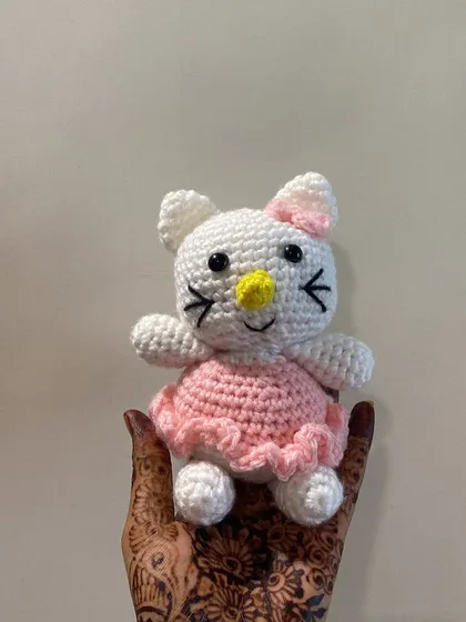 This Hello Kitty amigurumi is resting on my hand, which is decorated with henna. It’s a beautiful mix of my art and my culture.