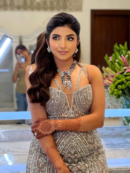 This candid shot shows how the reception makeup looks stunning from every angle, with a beautiful glow on the skin.