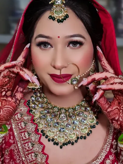 A close-up of my beautiful bride, showcasing a classic look with a bold red lip and defined eyes. You can also see her intricate henna and custom nail art, all coming together to create the perfect bridal portrait.