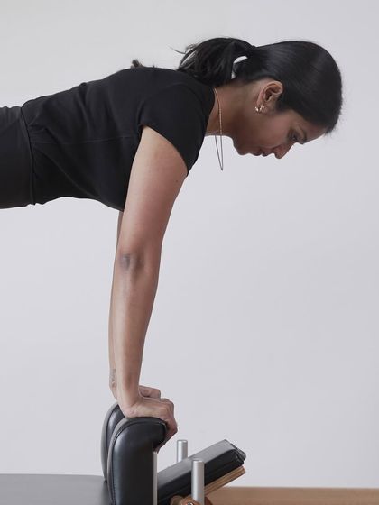 This shot captures the intense focus required for this upper body exercise. It's a moment of pure concentration, where the mind is fully connected to the body's movement.