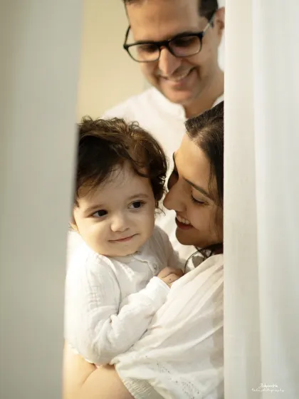 Peeking through the doorway, we see a family lost in their own little world. These are the unposed, in-between moments that hold so much emotion.