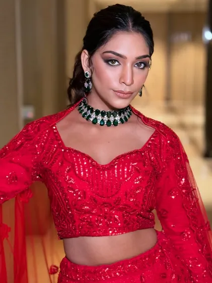 Make a bold statement at your next cocktail party or sangeet. This modern choker, featuring striking green stones set against sparkling zircons, is designed for the woman who isn't afraid to be the center of attention.