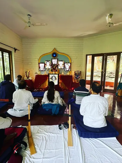 Meditating before the altar during our Christmas celebration. The room is filled with a quiet, reverent energy as we honor the Christ consciousness within all.