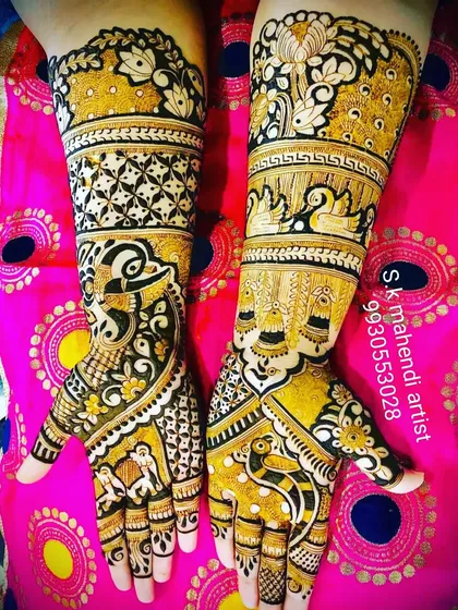 A colorful and bright design with peacocks and swans. The use of yellow henna highlights makes the traditional motifs stand out.