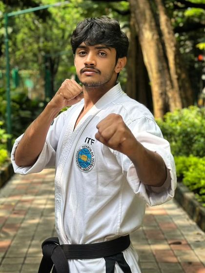 A portrait of MD Ikram, one of our dedicated black belt students, in his fighting stance.