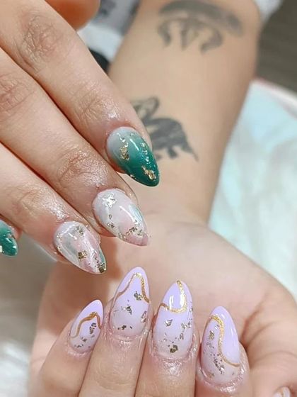 An artistic mismatched set combining green ombre, lavender with gold marble lines, and a pink and white marble effect with gold foil.