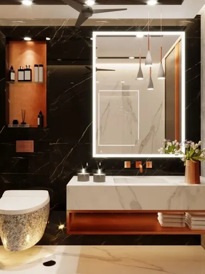 This high-end toilet design for a residence in Agra features dramatic black marble with striking white and gold veins. We paired it with a custom white marble vanity and rose gold fixtures to create a bold and luxurious statement.