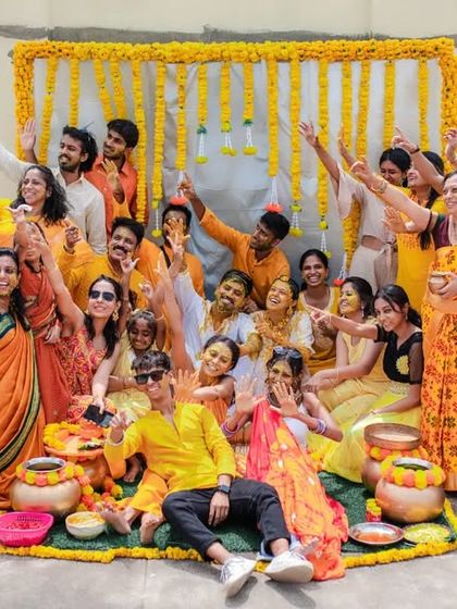 A fantastic group photo from a rooftop Haldi ceremony. We love capturing the collective joy and celebration of all your loved ones together.