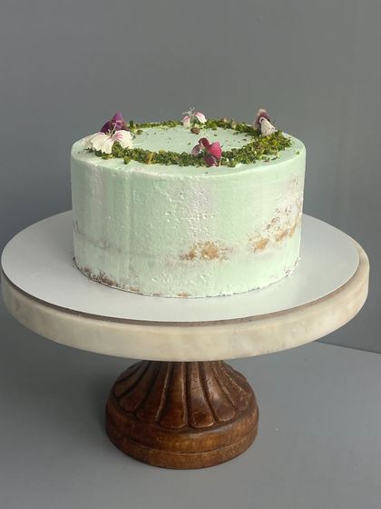 If you're not a fan of too much cream, my semi-naked cakes are for you. This pistachio cake is light, fluffy, and full of flavour, with just enough frosting to complement the sponge.