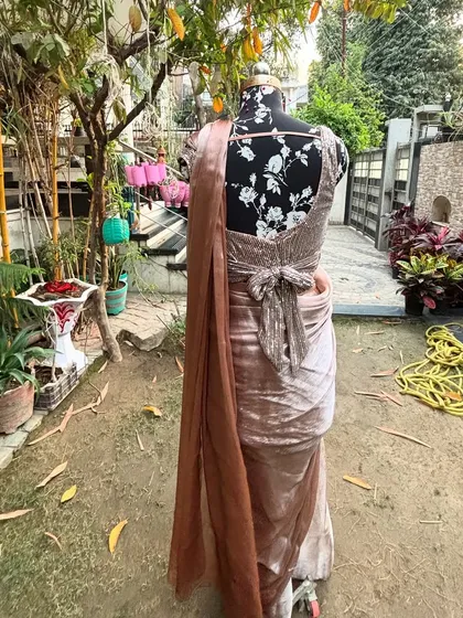 The back view of the 'SAJEELI' saree, highlighting the unique bow detail on the sequined blouse. It’s all about those little details.