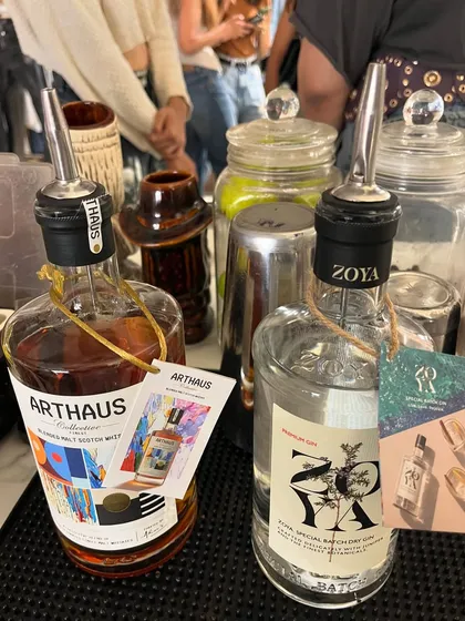 Featuring premium partner brands, Zoya Gin and Arthaus Scotch, with custom-branded tags for a corporate event.