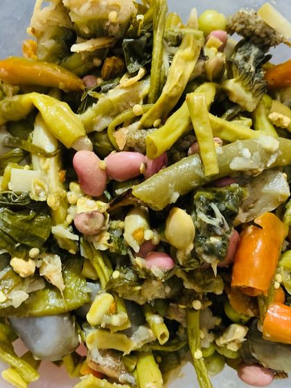 A bowl of Rosop, a traditional Naga stew cooked with different vegetables in bamboo shoot juice.