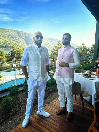 Posing with my DJ partner against the stunning backdrop of the Bodrum hills and sea.