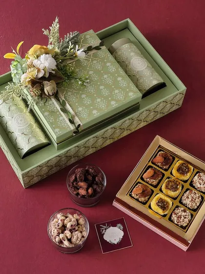 The Green Aura hamper is for a Diwali filled with freshness. It features our Mexican trail mix, mini butter cookies, and a large box of assorted chocolates.
