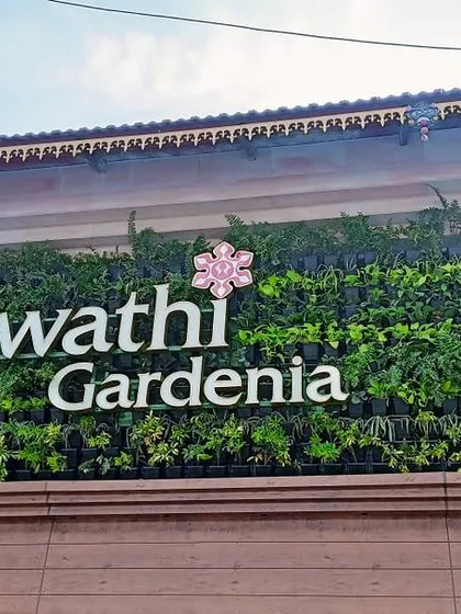We help businesses make a green statement with stunning vertical gardens. This living wall we designed and installed for Swathi Gardenia transforms their building's facade into a landmark of lush, sustainable design.