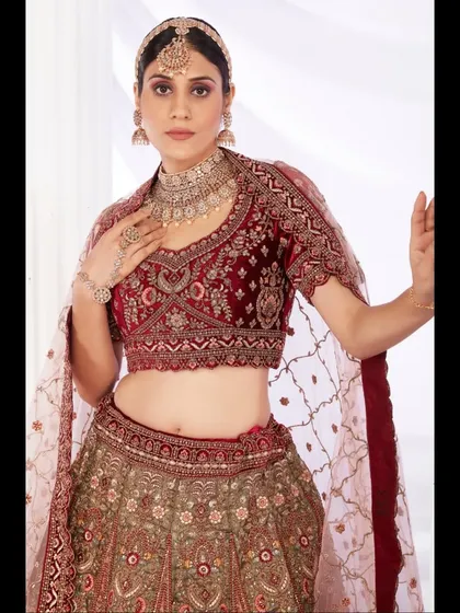 It's all in the details. I handpick each piece for its exquisite craftsmanship, like the rich velvet and intricate zardozi work on this classic bridal lehenga.