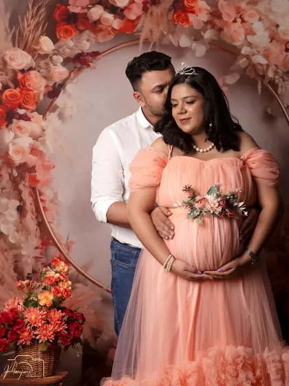 Capturing the quiet whispers and shared smiles between partners is one of my greatest joys. Here, a couple shares an intimate moment, beautifully framed by our popular boho floral ring setup, creating a warm and timeless portrait of their journey together.