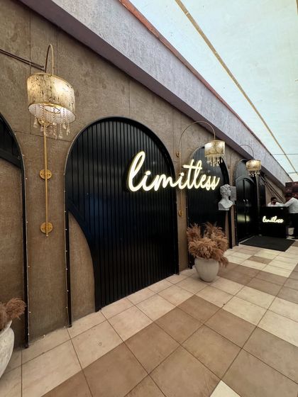 The chic entrance to Limitless, setting the tone for a stylish dining experience.