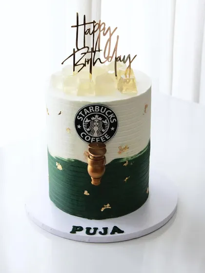 A full view of the Starbucks pouring cake, designed to look like one of their iconic cups. The entire cake is finished with my signature colored ganache.