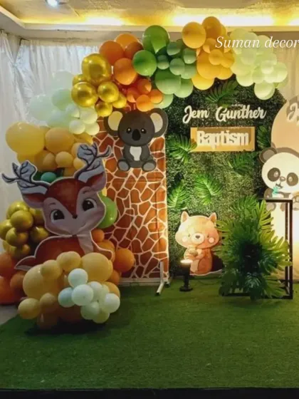 A different view of the woodland animal party, showcasing the deer cutout and the mix of green, yellow, and orange balloons that create a warm and inviting atmosphere.