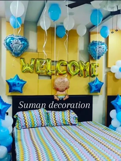 A lovely bedroom setup to welcome a new baby boy. I used blue and white balloons, star and heart-shaped foils, and a "Welcome" foil balloon banner to create a cheerful surprise.