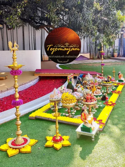 A bloom here, a sparkle there. This outdoor setup highlights the beauty of traditional brass lamps decorated with fresh flowers.
