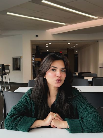 A fun, engaging shot from a college study area, showing personality and connecting with the student audience.