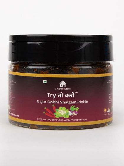 A smaller jar of Gajar Gobhi Shalgam Pickle, isolated on white.