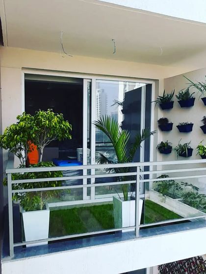 A view from another apartment, showing how our balcony design with vertical planters stands out.