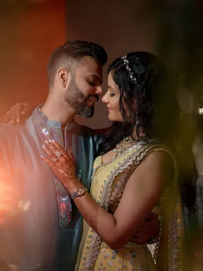 An intimate couple portrait taken at night, using the warm glow of surrounding lights to create a romantic atmosphere. This shot shows how I work with different lighting conditions to capture mood and connection, whether it's day or night.